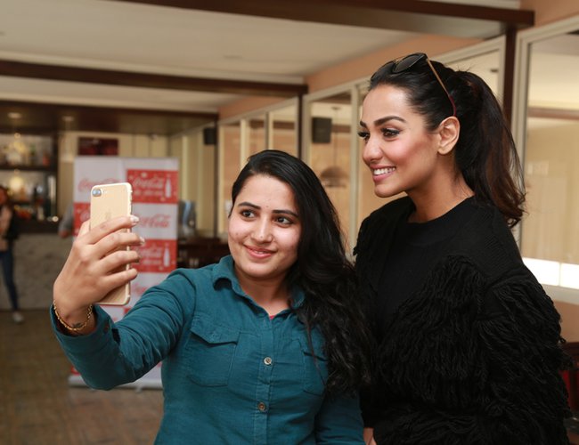 A fan’s star-struck moment with Priyanka Karki during Coca-Cola Momotsav outlet visit.jpg